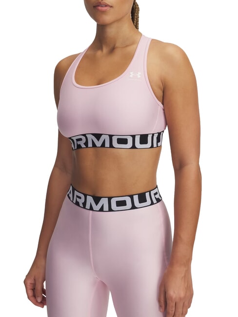 UNDER ARMOUR HG MID Biustonosz sportowy różowy prime - Biustonosze damskie